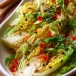 Bowl of crunchy Asian cabbage salad with fresh vegetables and dressing
