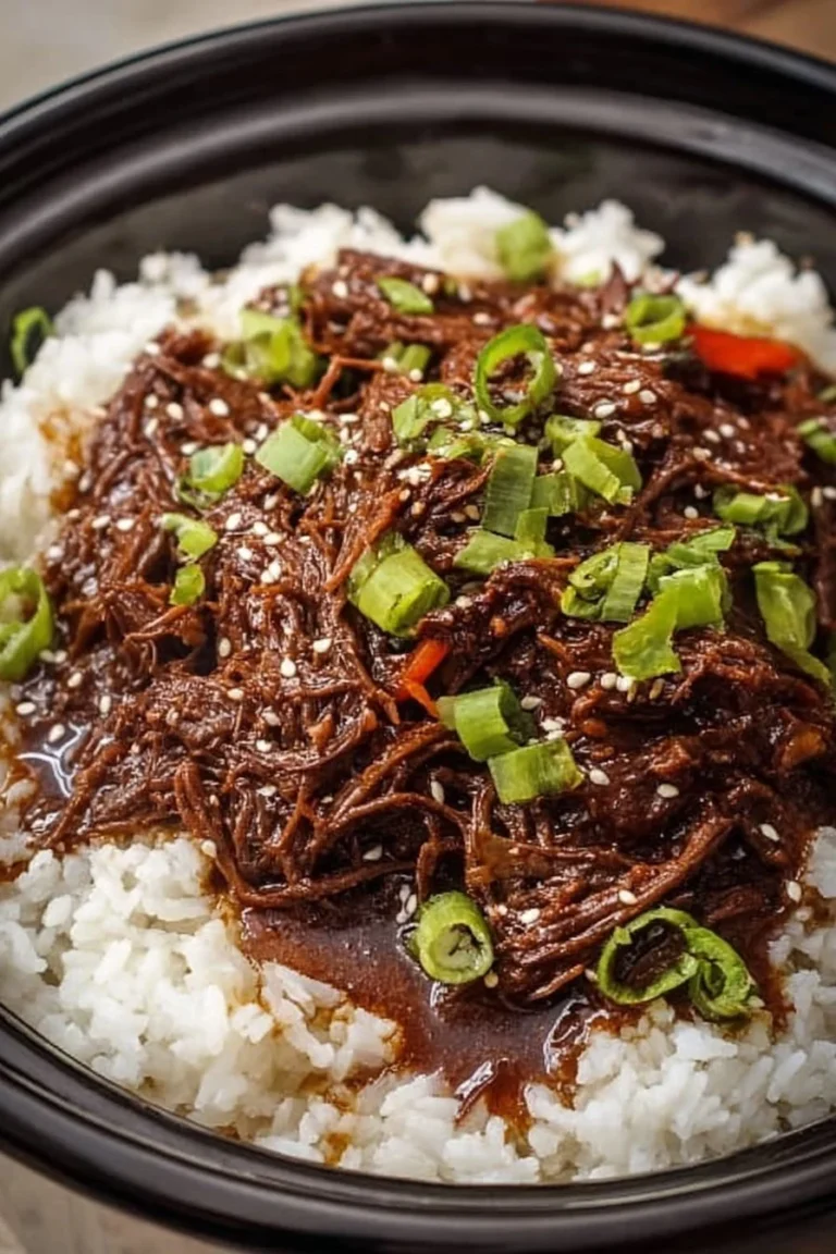 Healthy Crock Pot Korean Beef dish served with rice and vegetables.