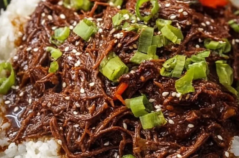 Healthy Crock Pot Korean Beef dish served with rice and vegetables.