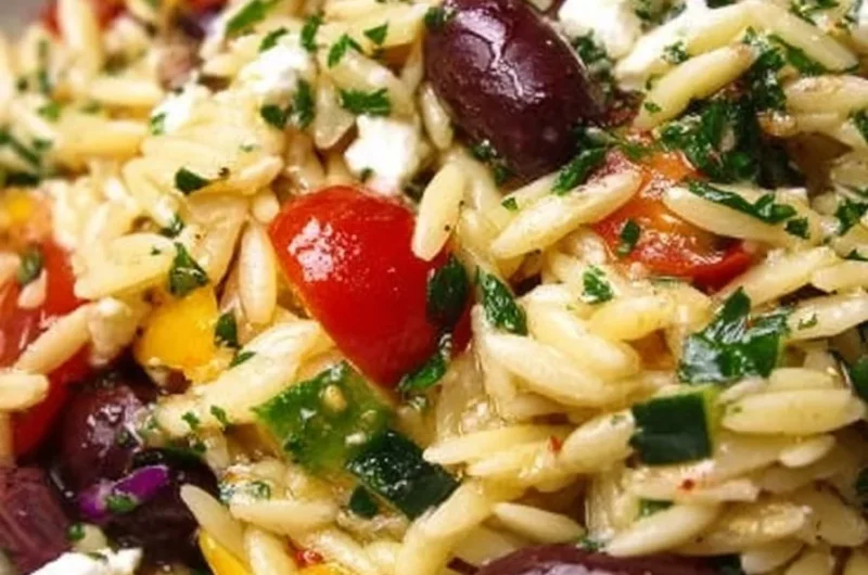 Mediterranean Orzo Salad with feta, olives, and fresh herbs in a bowl