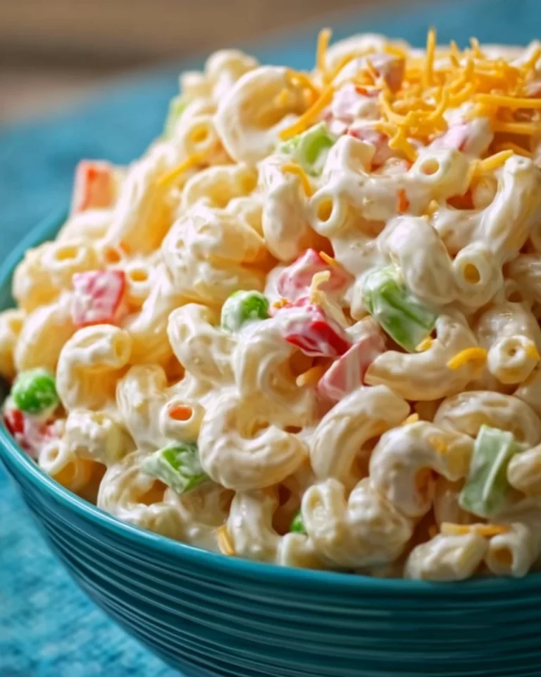 Creamy macaroni salad served in a bowl with fresh ingredients