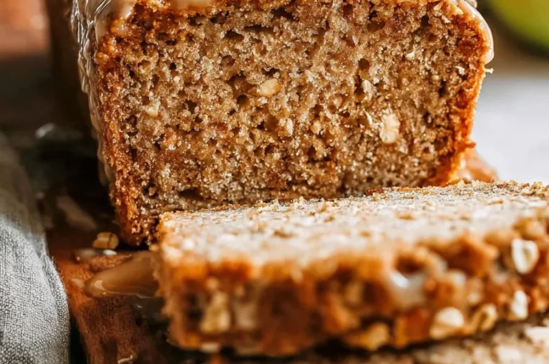 Homemade apple cinnamon oatmeal bread loaf with oats and spices