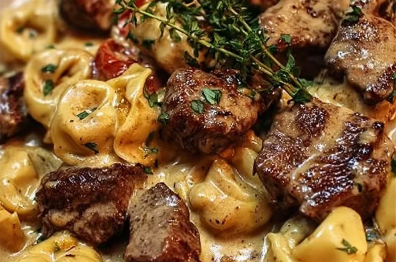 Delicious garlic steak tortellini served in a creamy sauce with fresh herbs