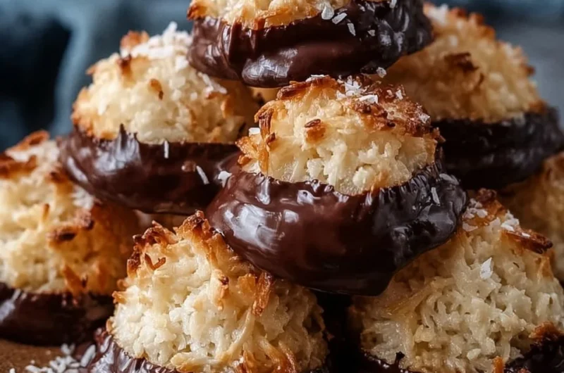 Perfect chocolate-dipped coconut macaroons on a plate, ready to be enjoyed