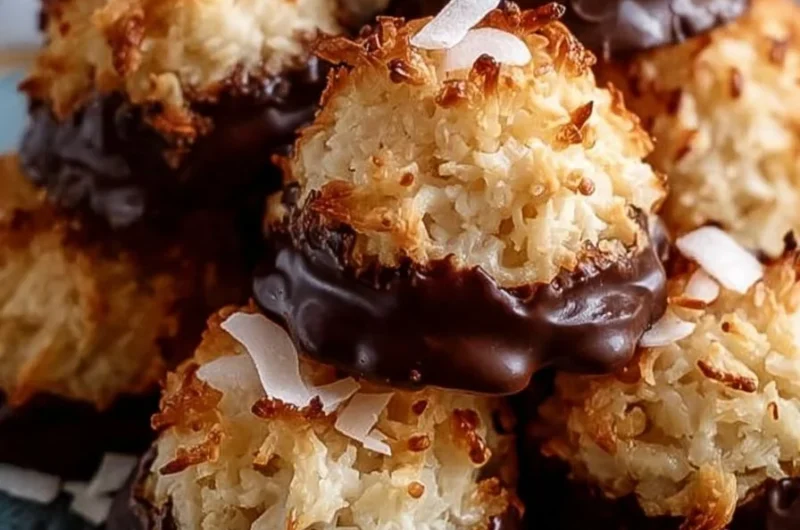 Delicious chocolate-dipped coconut macaroons on a plate