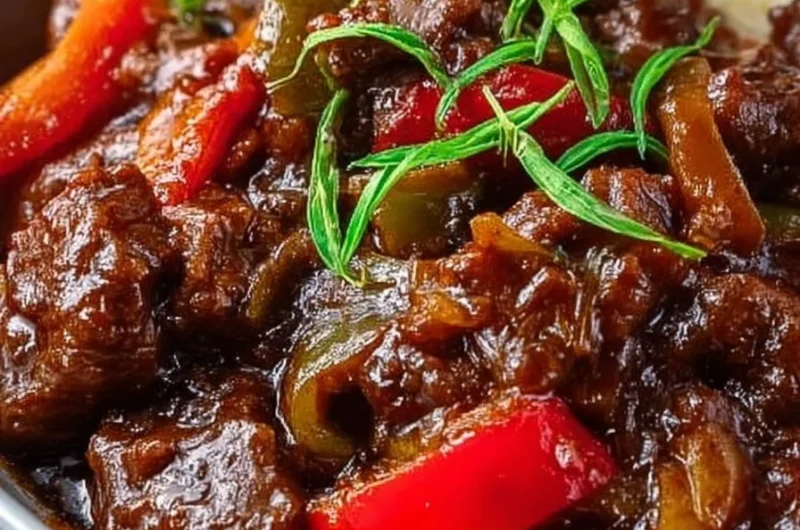 Slow cooked pepper steak served with vegetables on a plate