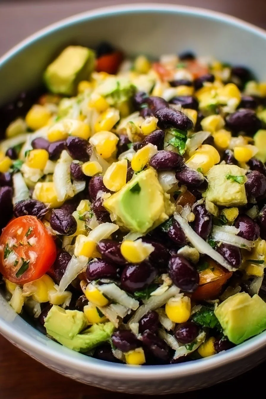 Colorful corn black bean avocado salad with fresh ingredients