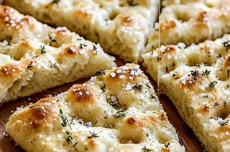 Freshly baked focaccia bread with herbs on a wooden board