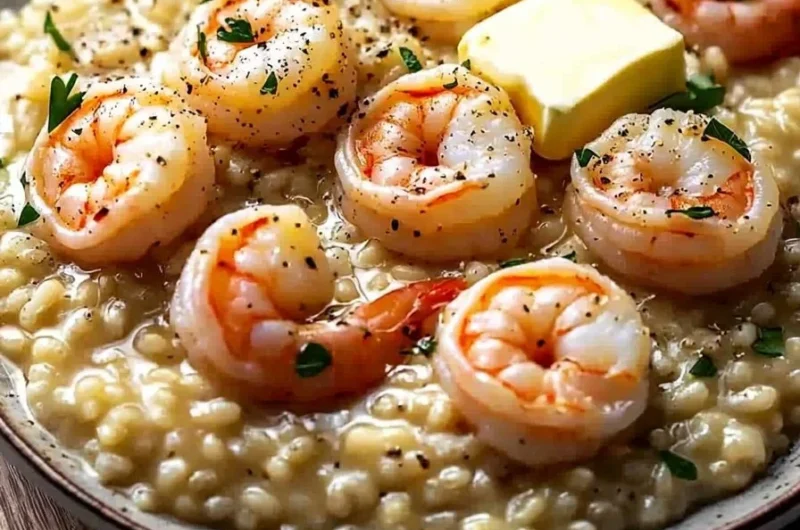 Cozy creamy shrimp risotto served in a bowl garnished with parsley.