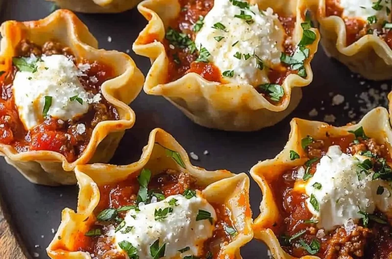 Easy lasagna cups with layers of cheese and sauce served in muffin tins