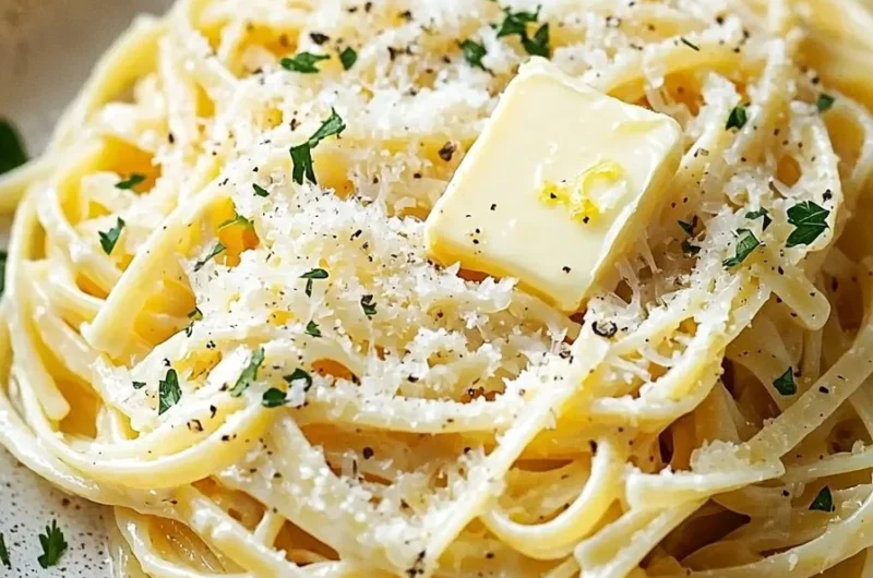 Plate of easy lemon butter linguine topped with fresh parsley and lemon zest.