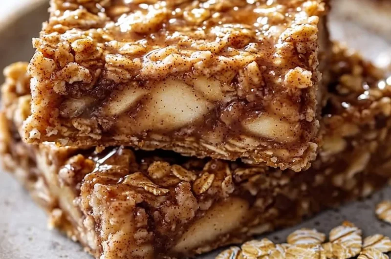 Homemade Apple Cinnamon Breakfast Bars on a wooden table.