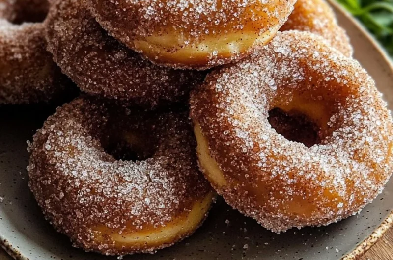 Brown butter apple cider donuts sprinkled with cinnamon sugar