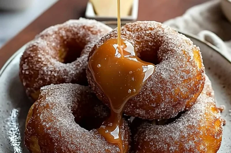 Delicious brown butter apple cider donuts topped with salted caramel drizzle