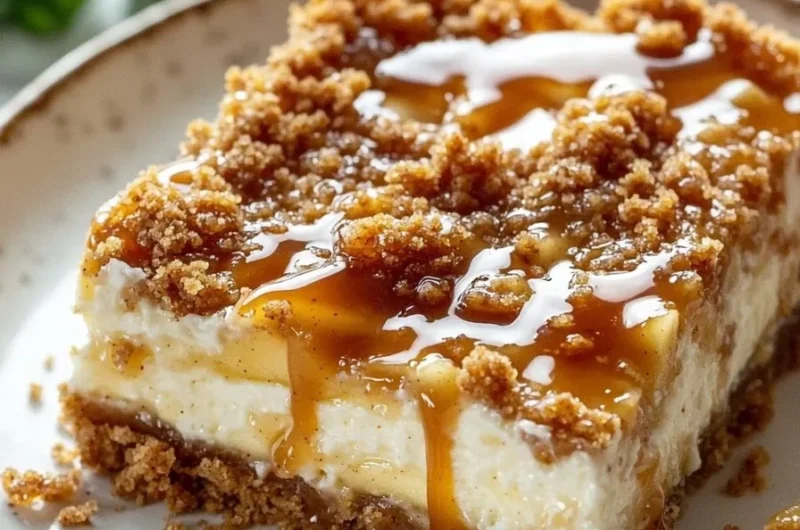 Delicious caramel apple cheesecake bars topped with caramel drizzle and apple slices