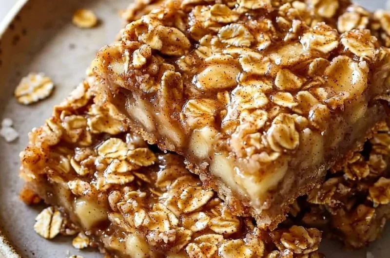 Delicious chewy apple cinnamon oatmeal bars on a plate