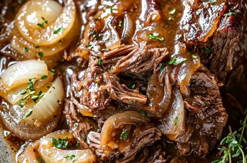 Crockpot French Onion Pot Roast served with herbs and onions