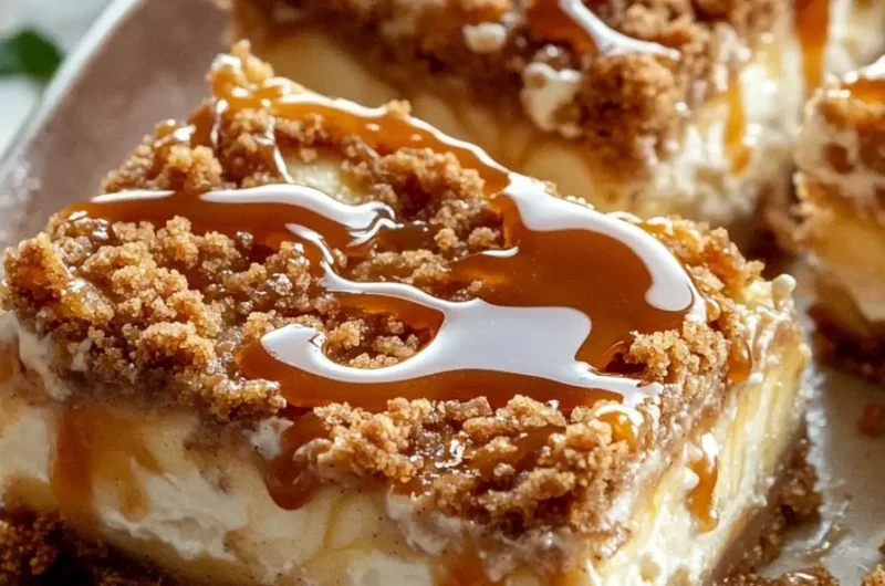 Delicious easy caramel apple cheesecake bars with caramel drizzle and apple chunks.