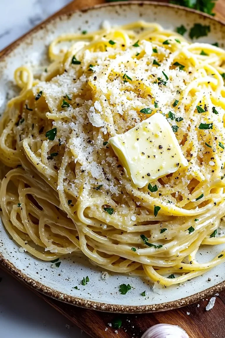 Delicious garlic butter noodles topped with Parmesan cheese