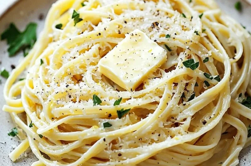Plate of Lemon Butter Linguine garnished with parsley and lemon zest.
