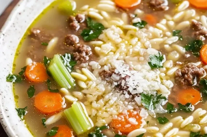 Bowl of Authentic Italian Wedding Soup with meatballs and greens