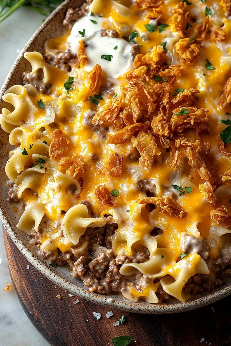 Delicious cheesy beef noodle casserole topped with crispy French onions