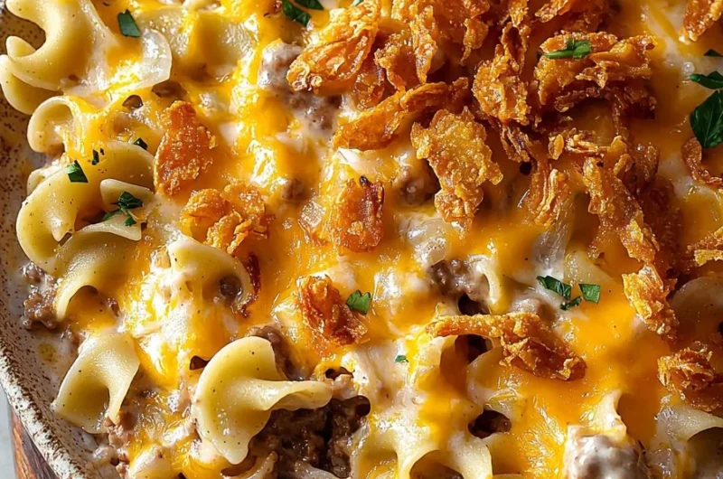 Delicious cheesy beef noodle casserole topped with crispy French onions