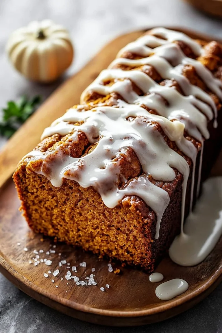 Delicious cinnamon roll pumpkin bread with cream cheese glaze on top.