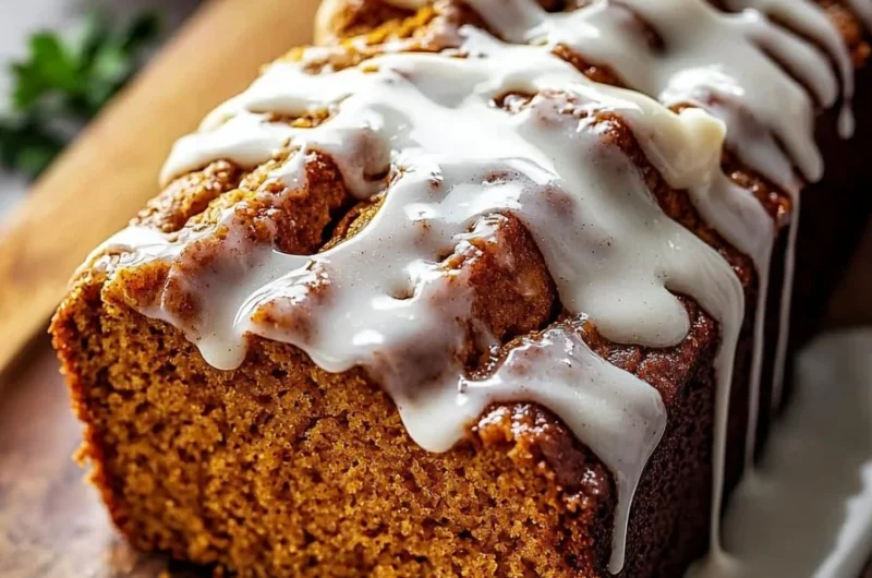 Delicious cinnamon roll pumpkin bread with cream cheese glaze on top.
