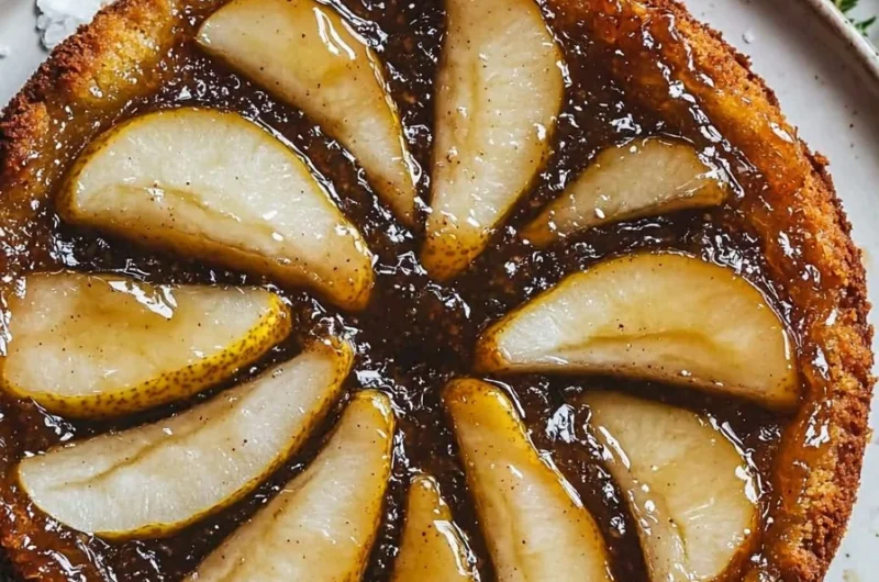 Delicious spiced pear upside down cake on a serving plate