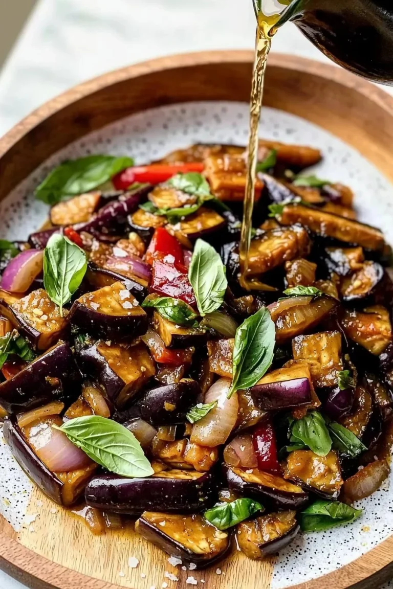 Vegan Easy Thai Basil Eggplant dish with colorful vegetables and aromatic herbs