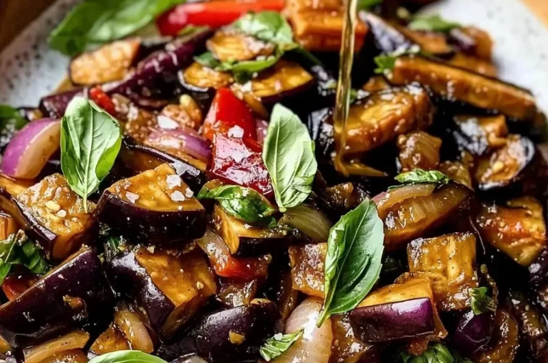 Vegan Easy Thai Basil Eggplant dish with colorful vegetables and aromatic herbs