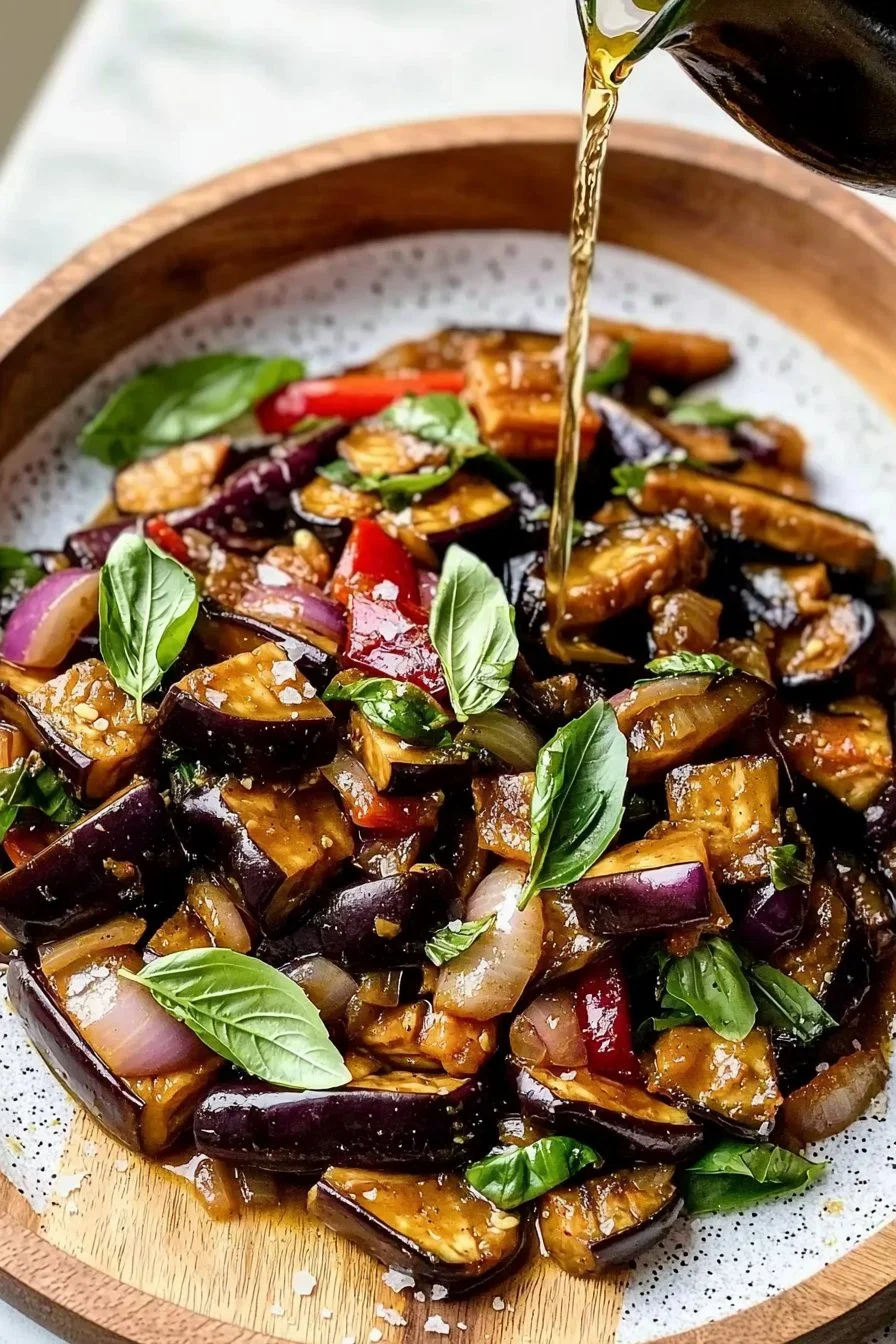 Vegan Easy Thai Basil Eggplant dish with colorful vegetables and aromatic herbs