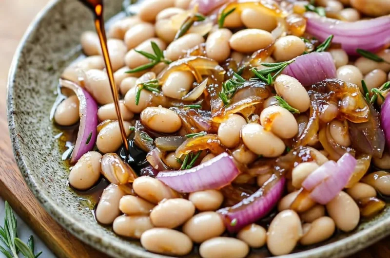Caramelized onion white beans dish with rosemary and balsamic glaze