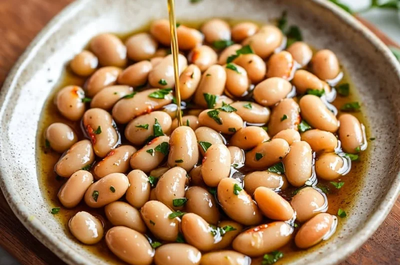 Bowl of marinated white beans with herbs and spices