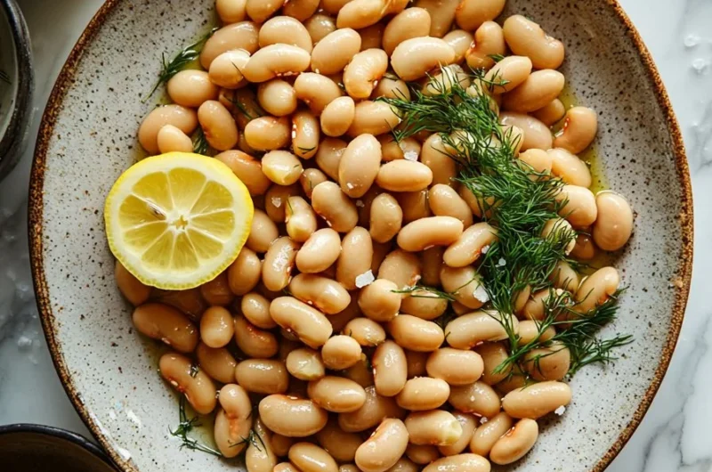 Spring Lemon Dill Butter Beans cooked in a vibrant dish, showcasing fresh flavors.
